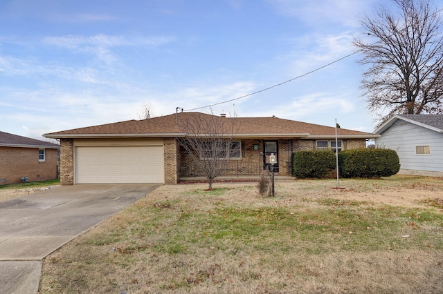 ranch-style home with a garage and a front lawn