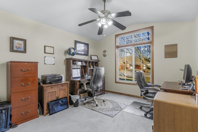 office area featuring ceiling fan, light colored carpet, and vaulted ceiling