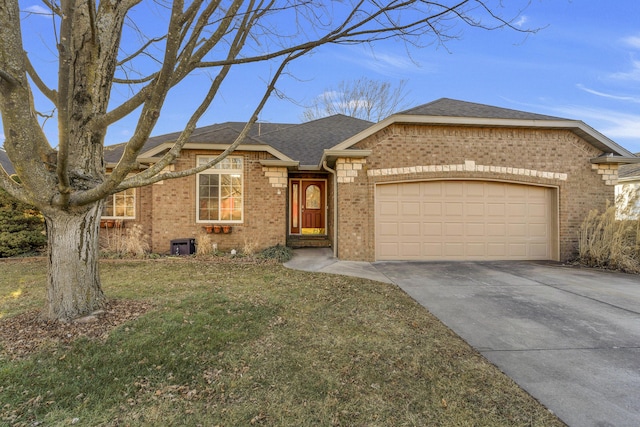 ranch-style home with a garage and a front lawn