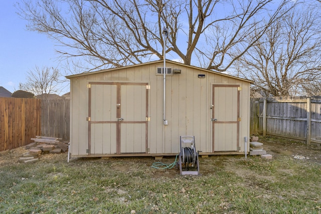 view of outbuilding featuring a yard