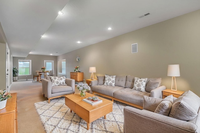 living room featuring light carpet