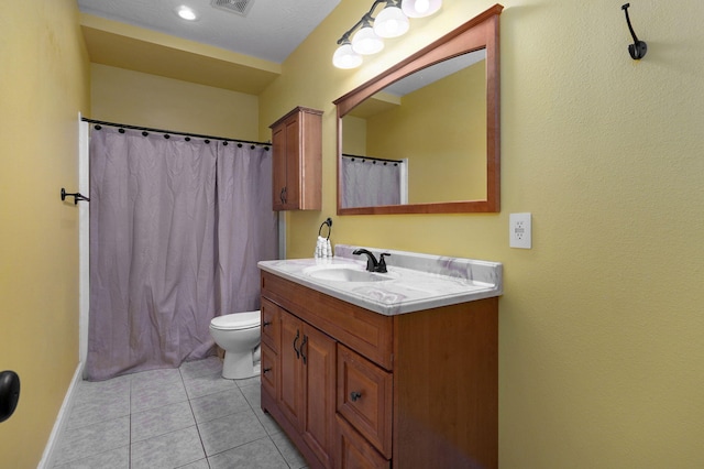 bathroom featuring tile patterned flooring, vanity, a shower with shower curtain, and toilet