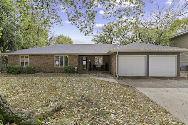 single story home with a garage and central AC