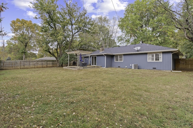 view of yard featuring a pergola and central AC