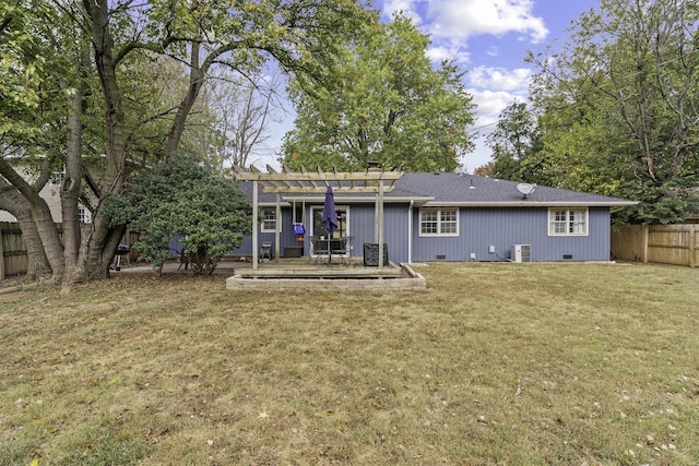 back of house featuring a pergola, a deck, a lawn, and central air condition unit