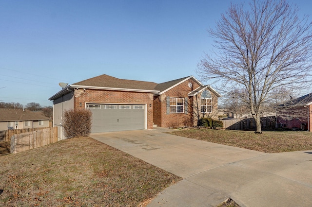 single story home featuring a garage and a front lawn