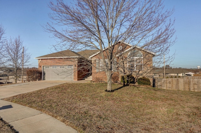 view of front of house with a garage and a front yard