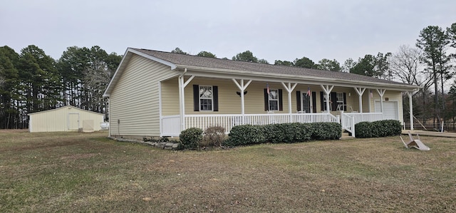 view of front of house with a porch, a storage shed, and a front lawn