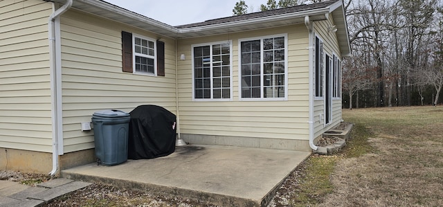 view of side of property with a patio