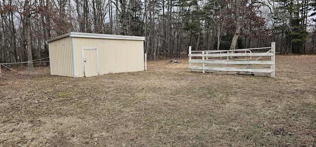 view of outbuilding with a lawn