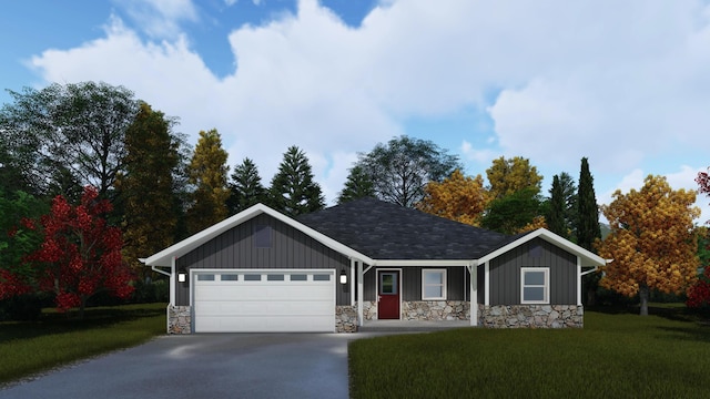 view of front of home featuring a garage and a front lawn