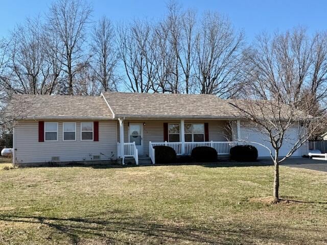 ranch-style home with a front lawn and covered porch