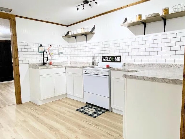 kitchen featuring tasteful backsplash, white range with electric stovetop, light wood-type flooring, and white cabinets