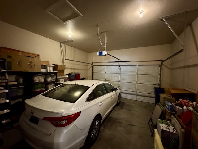 garage featuring a garage door opener