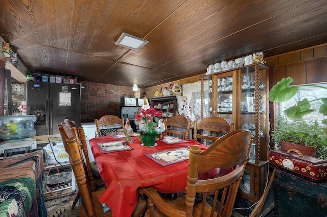 dining room featuring wood ceiling