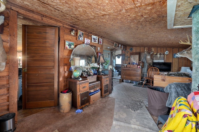 living room with wood walls