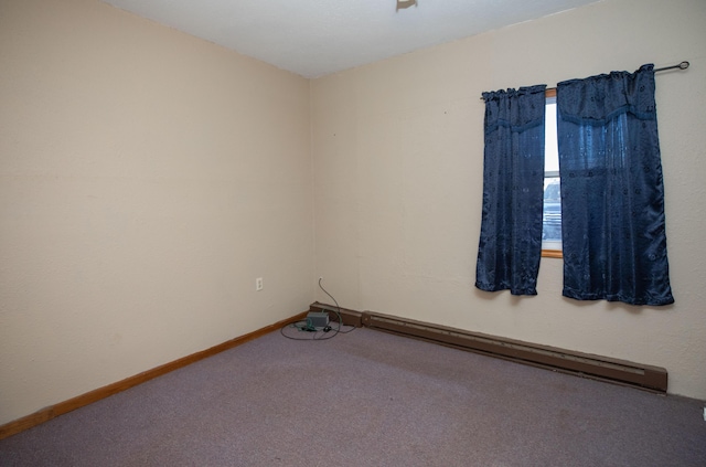 empty room with a baseboard radiator and carpet flooring