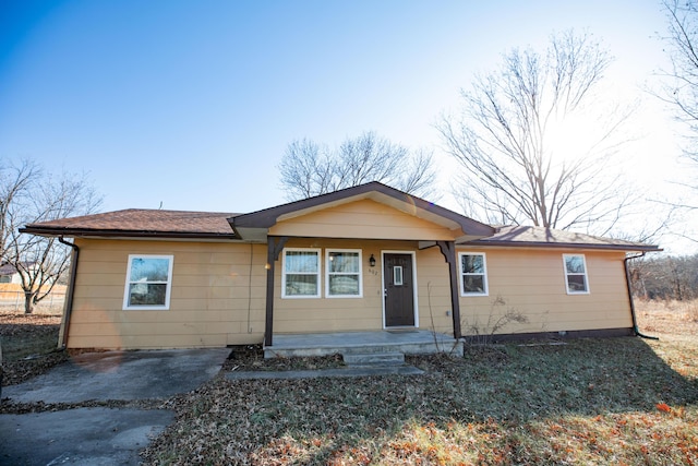 single story home with covered porch