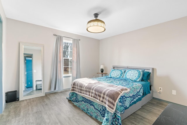 bedroom featuring hardwood / wood-style flooring