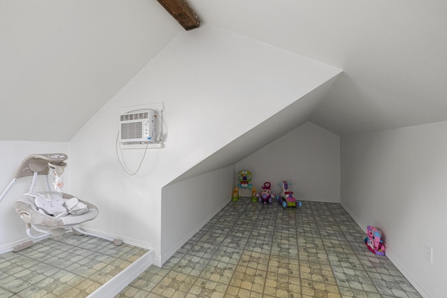 playroom featuring a wall mounted AC and lofted ceiling with beams