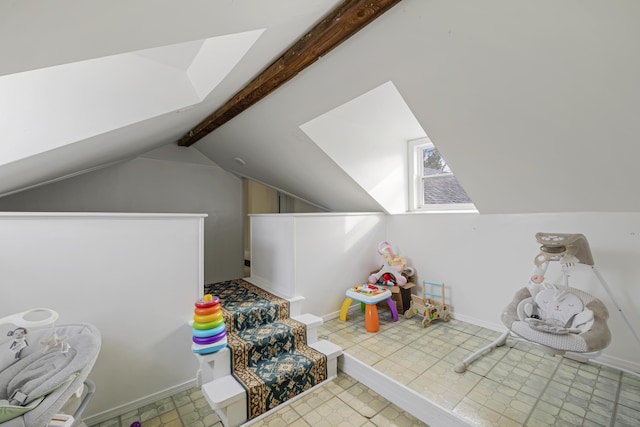 recreation room with lofted ceiling with beams