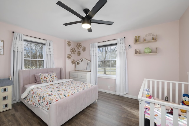 bedroom featuring dark hardwood / wood-style flooring and ceiling fan