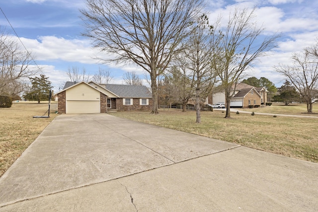 ranch-style home featuring a garage and a front lawn