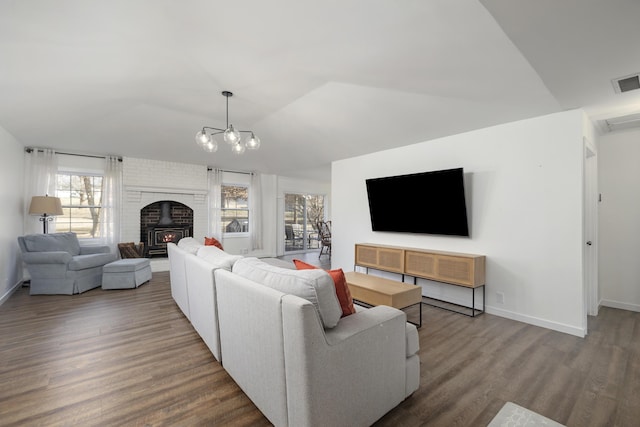 living room featuring vaulted ceiling and hardwood / wood-style floors