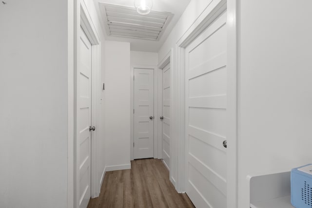 corridor with dark hardwood / wood-style floors