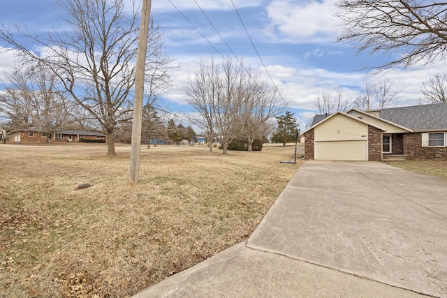 view of yard featuring a garage