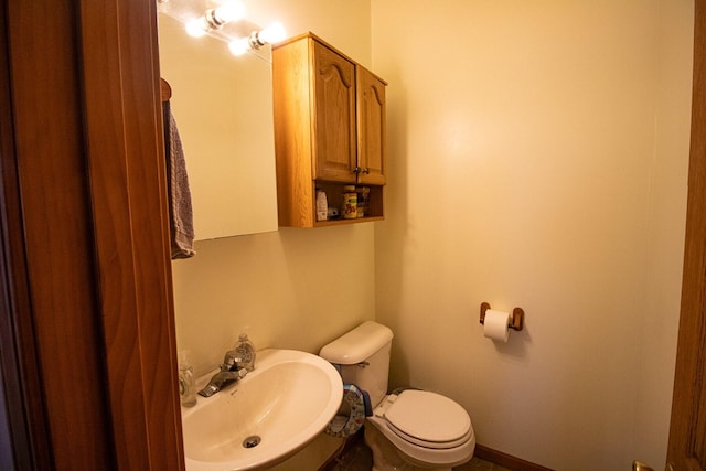 bathroom with sink and toilet