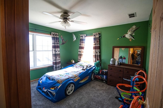 carpeted bedroom with ceiling fan