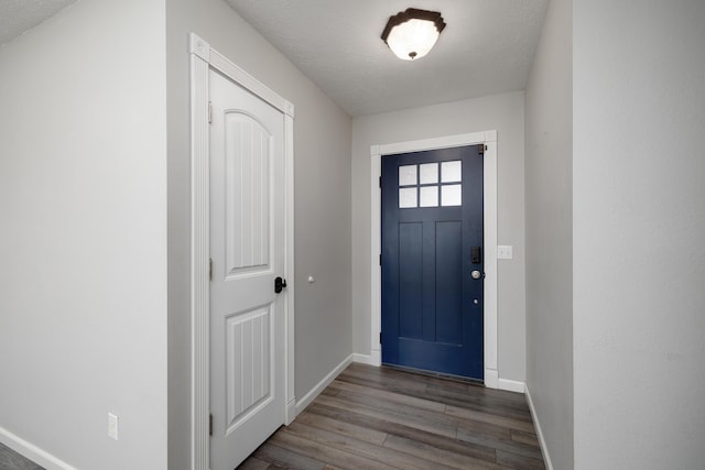 entrance foyer with wood-type flooring and a textured ceiling