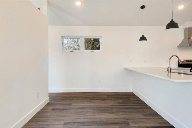 interior space featuring sink, dark wood-type flooring, and decorative light fixtures