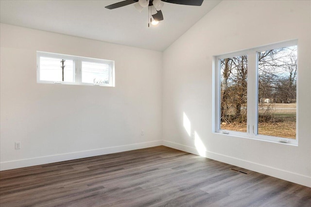 spare room featuring dark wood-type flooring, ceiling fan, and lofted ceiling