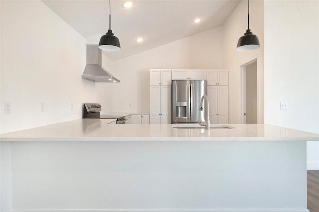 kitchen featuring wall chimney exhaust hood, white cabinetry, appliances with stainless steel finishes, kitchen peninsula, and pendant lighting