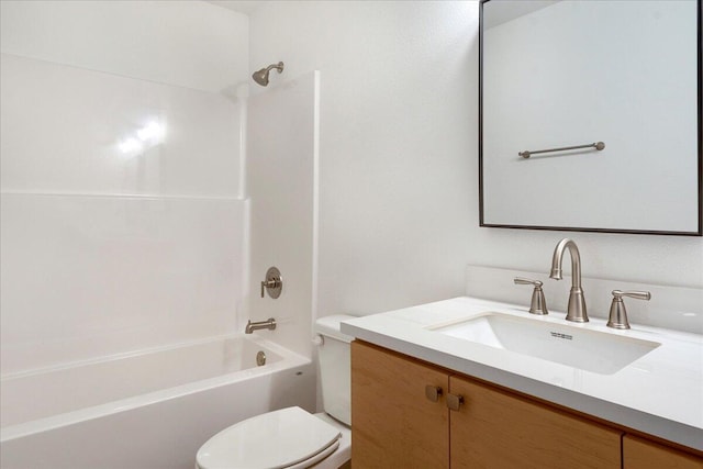 full bathroom featuring vanity, bathtub / shower combination, and toilet