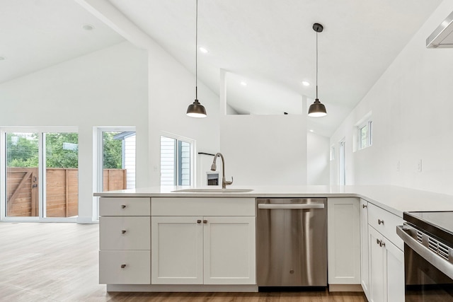 3481 W Moark St, Springfield, MO 65810 - kitchen with appliances with stainless steel finishes, high vaulted ceiling, plenty of natural light, pendant lighting, and white cabinetry