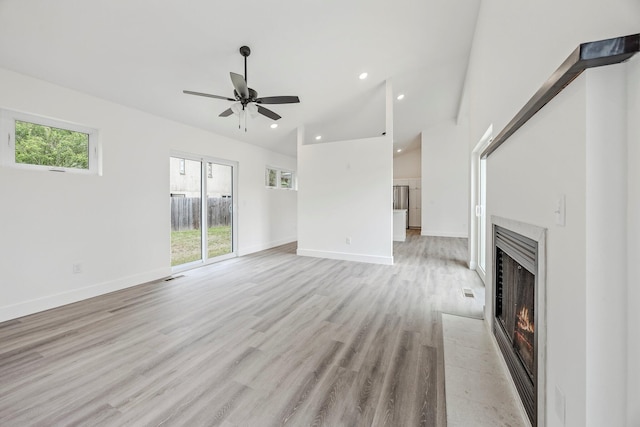 3481 W Moark St, Springfield, MO 65810 - unfurnished living room with a fireplace with flush hearth, ceiling fan, recessed lighting, lofted ceiling, and light wood-type flooring