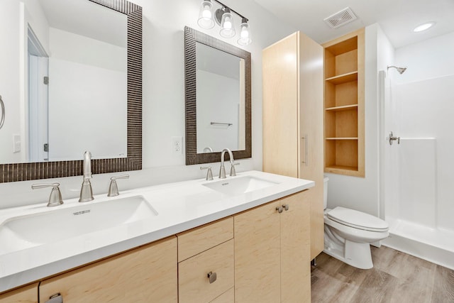 3481 W Moark St, Springfield, MO 65810 - full bathroom featuring double vanity, wood finished floors, and a shower