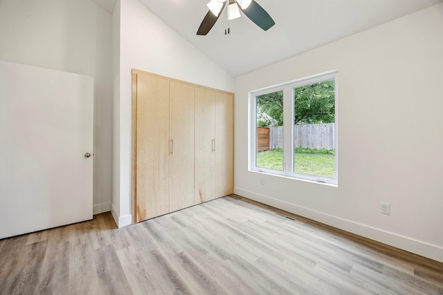 3481 W Moark St, Springfield, MO 65810 - unfurnished bedroom with vaulted ceiling, light wood-style floors, a closet, and a ceiling fan