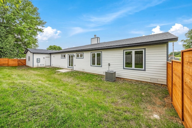 3481 W Moark St, Springfield, MO 65810 - rear view of house with a fenced backyard and a chimney
