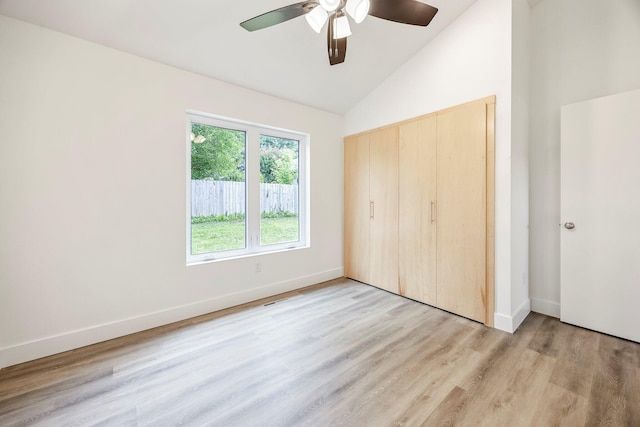 3481 W Moark St, Springfield, MO 65810 - unfurnished bedroom with light wood-style flooring, a closet, ceiling fan, and high vaulted ceiling