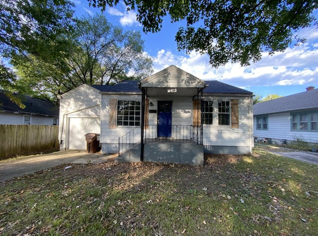 bungalow-style home with a garage