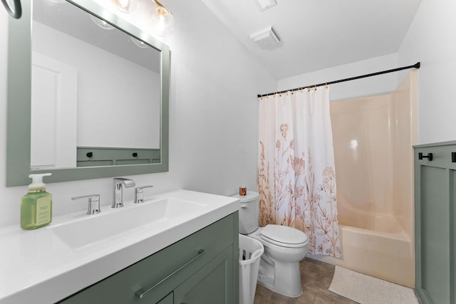 full bathroom featuring shower / tub combo, vanity, tile patterned floors, and toilet