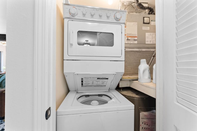 laundry room with stacked washer and clothes dryer