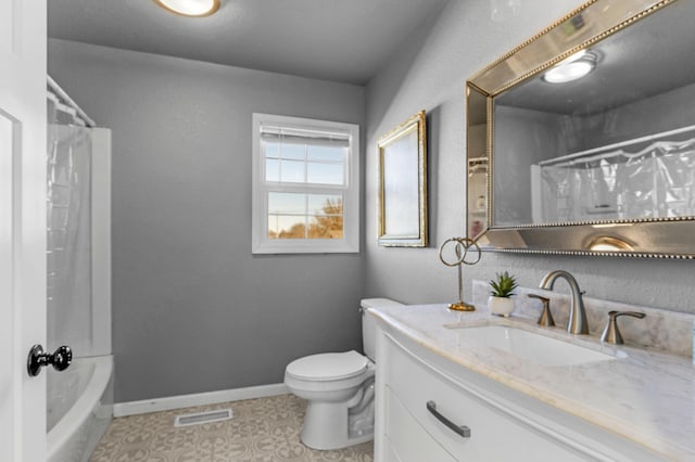 full bathroom with vanity, shower / tub combo, and toilet