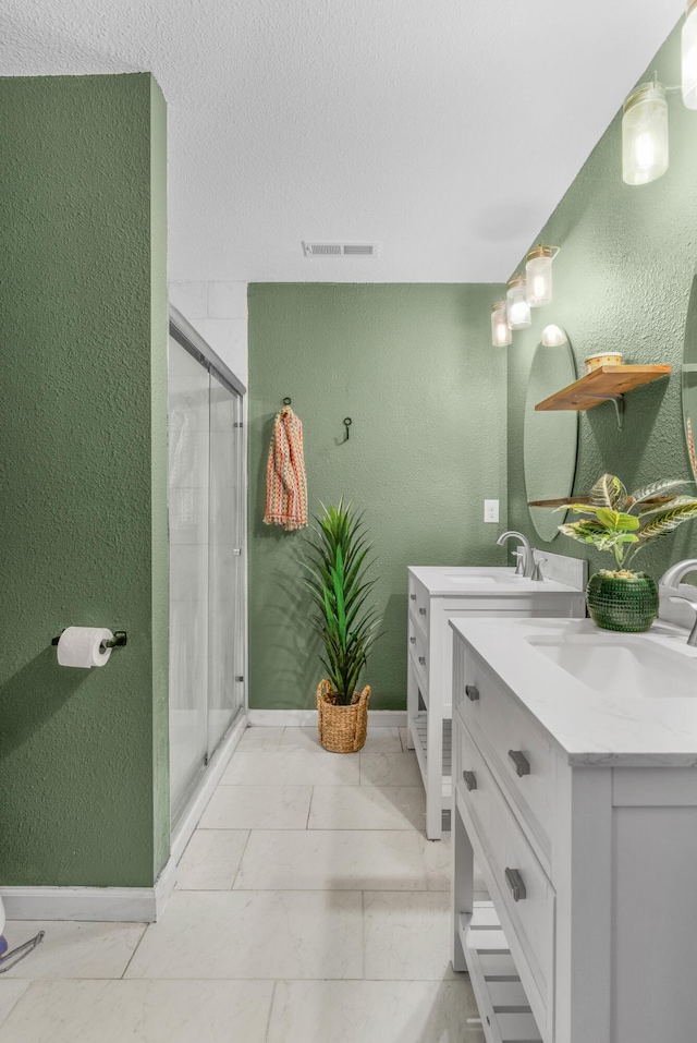 bathroom with vanity and walk in shower