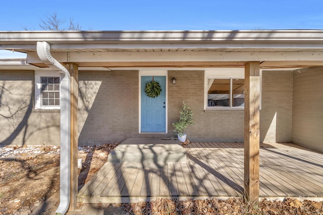 doorway to property with a deck