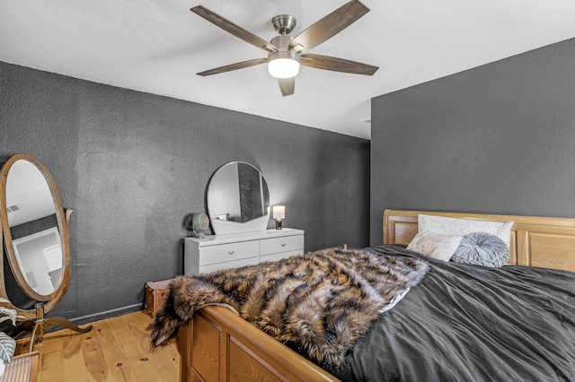 bedroom featuring ceiling fan and light hardwood / wood-style floors